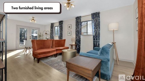 A living room with a sofa and a chair.