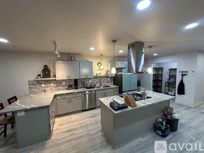 A modern kitchen with a large island in the middle.