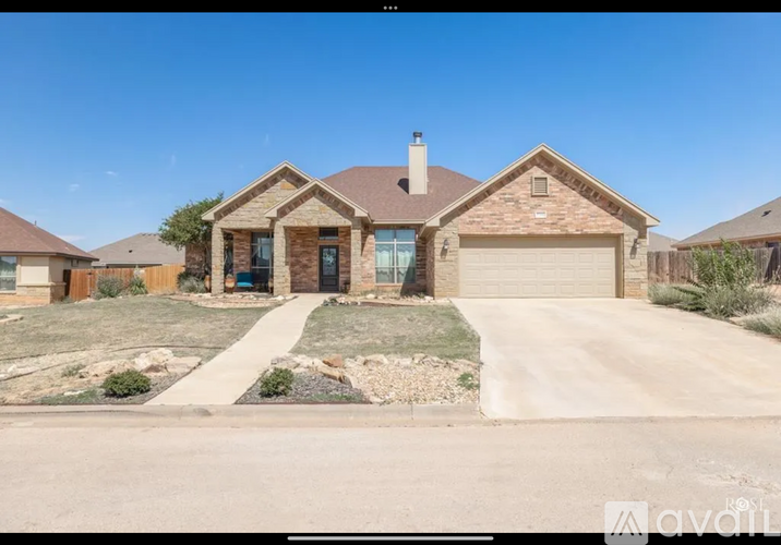 A house with a garage is available for sale.