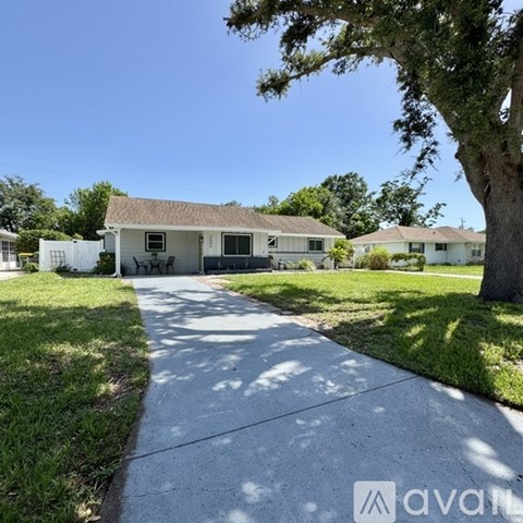 A house with a driveway in front of it.