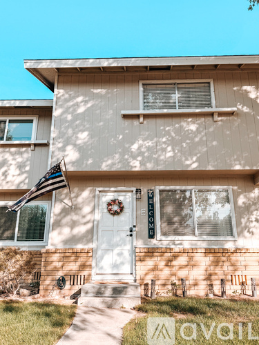 A house with a flag on the front porch.