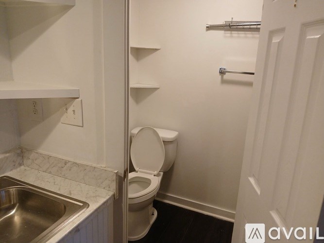 A small bathroom with a toilet and a sink.