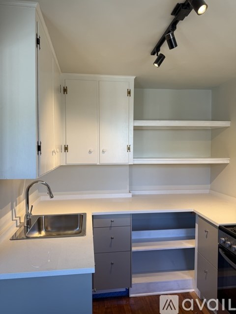 A kitchen with a sink and cabinets.