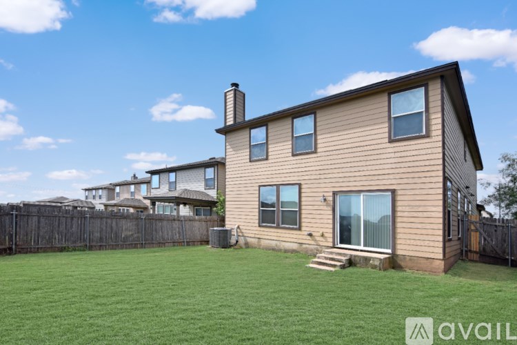 A bathroom with a bathtub, toilet, and sink.