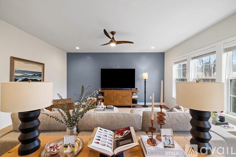 A modern kitchen with a dining table set for four.