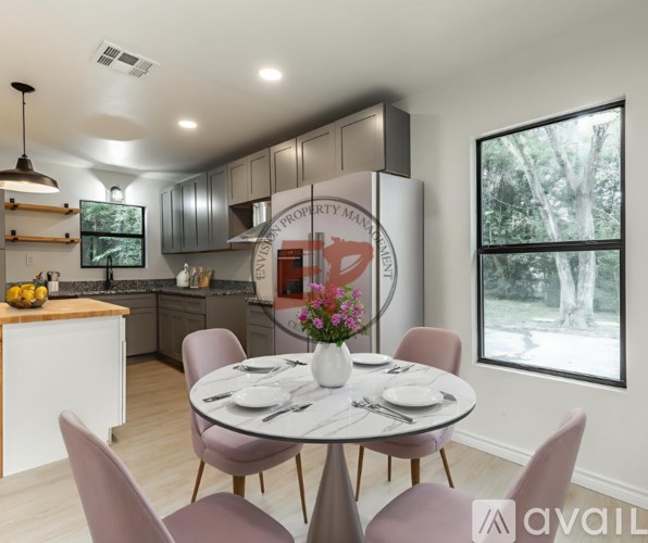 A kitchen with a dining table set for four.