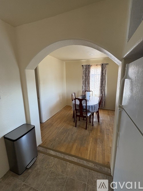 A small room with a table and chairs in it.