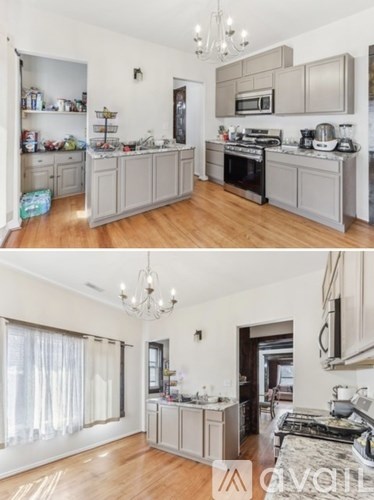 A kitchen with wooden floors and a chandelier.