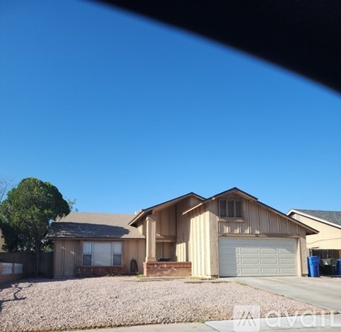 A house with a garage and a driveway.