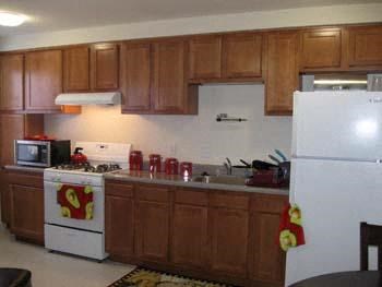 a kitchen with a stove and a refrigerator