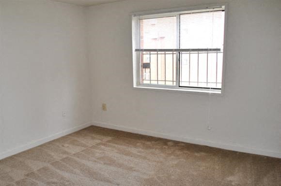 an empty room with a window in it