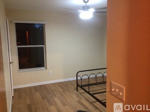 A room with a bed and a window.