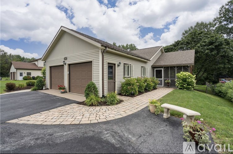 A house with a garage and a driveway.