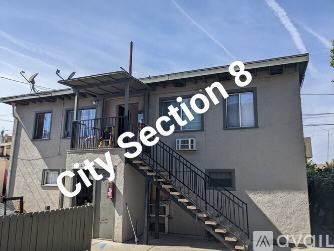 A house with the text "City Section 8" on it.