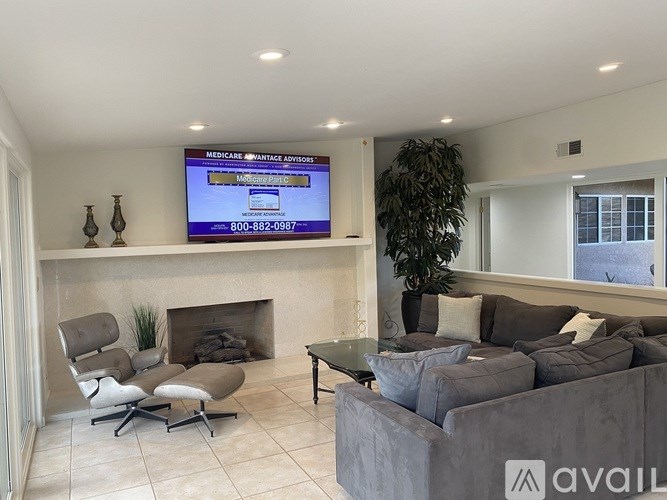 A living room with a television displaying a Medicare advertisement.