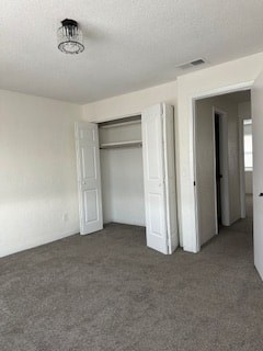 A room with a white door and a white closet.