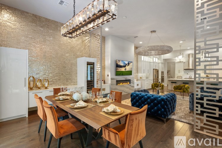 A modern dining room with a wooden table and chairs.