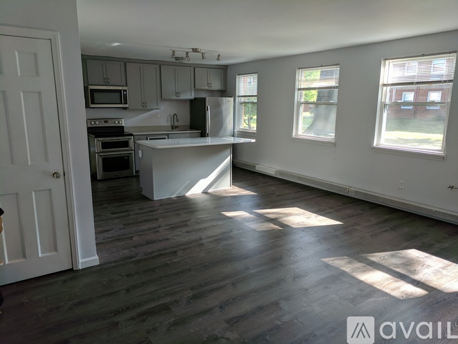 A kitchen with a large island in the middle of the room.