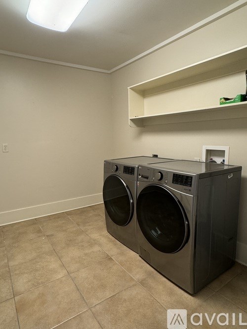 A laundry room with a washer and dryer.