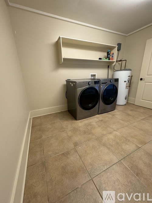 A laundry room with a washer and dryer.