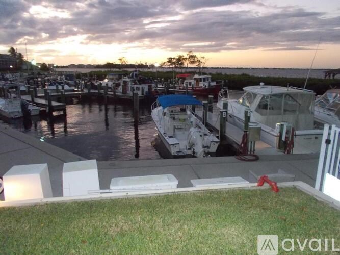 A marina with boats docked at the pier.