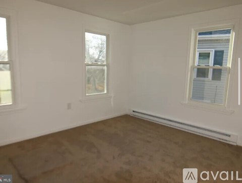 A room with a window and a wall with a window.