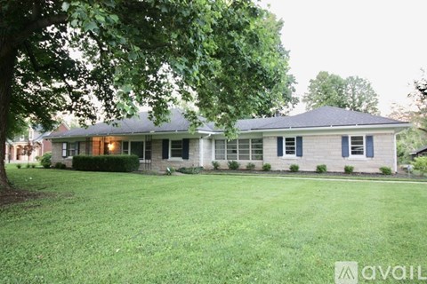 A house with a lawn in front of it.