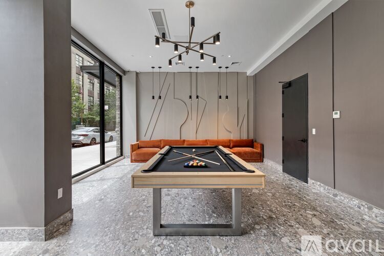 A pool table in a room with a modern design.