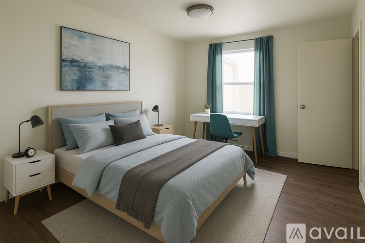 A bedroom with a large bed and a painting on the wall.