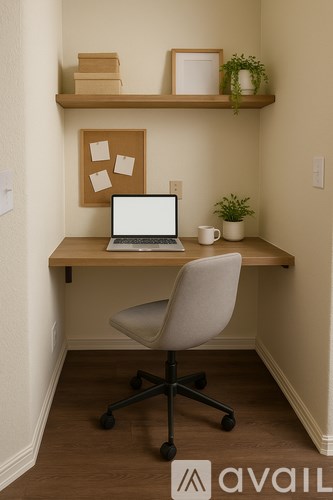 A laptop is on a desk with a chair and a shelf above it.