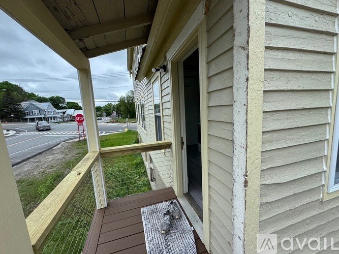 A house with a red stop sign in the background.