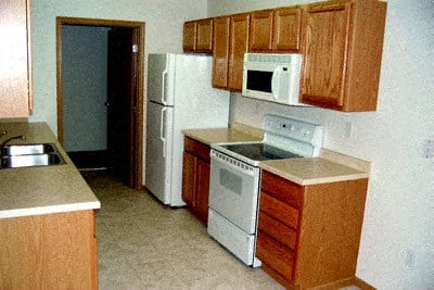 a kitchen with a stove microwave and refrigerator