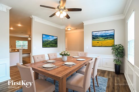 A dining room with a wooden table set for six.