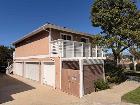 A two-story house with a garage on the side.