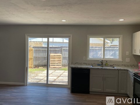 A kitchen with a sink and a window.