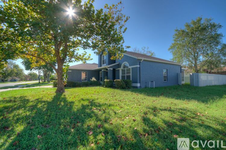 A house with a blue exterior is for sale.