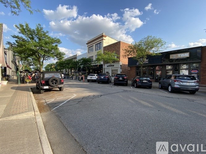 Cars are parked on the side of the street.