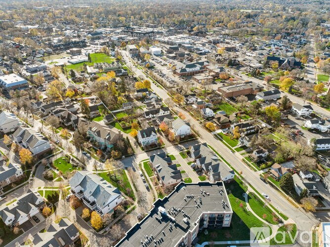 A bird's eye view of a residential area with houses and trees.