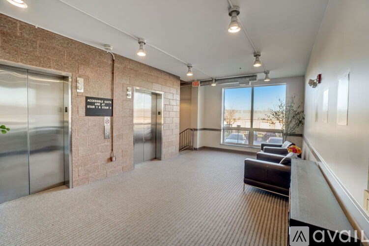 A hallway with a sign that says "No Smoking" and a window with a view of the desert.