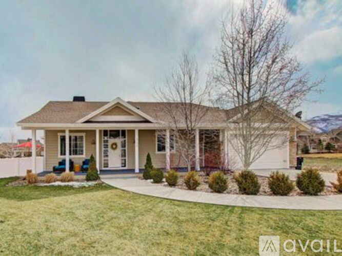 A house with a front yard and a driveway.