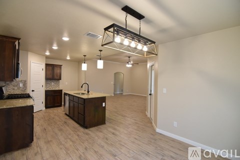 A kitchen with a sink and a counter is available.