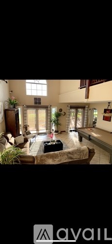 A living room with a couch and a coffee table.