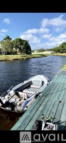 A boat is docked at a wooden pier.