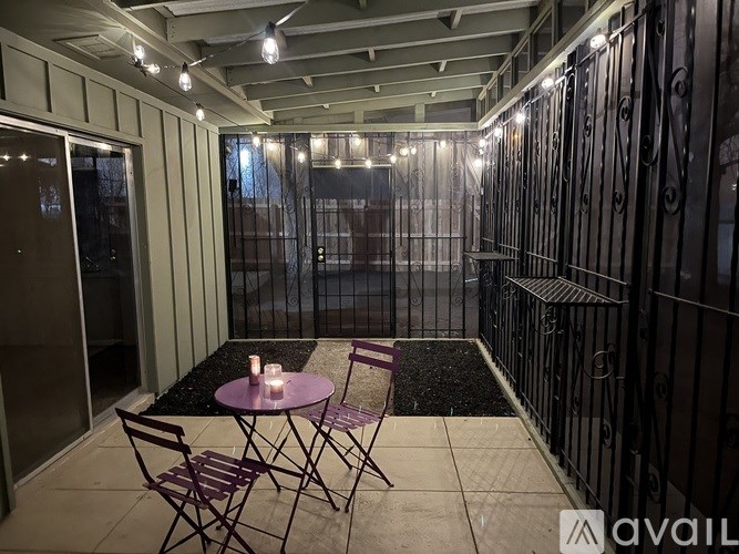A patio with a table and chairs is set up.