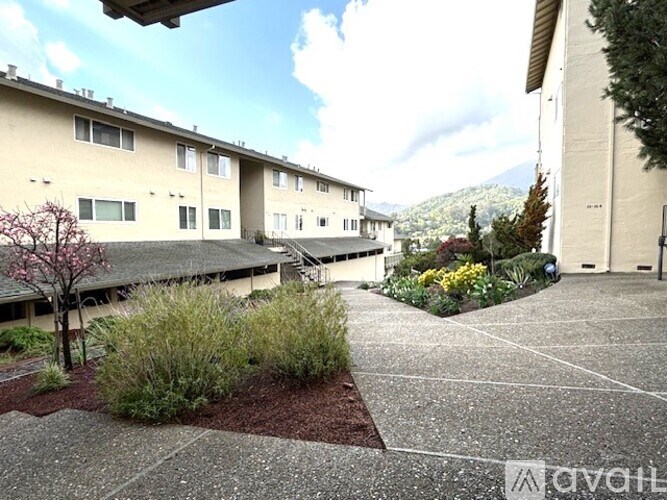 A building with a courtyard in front of it.
