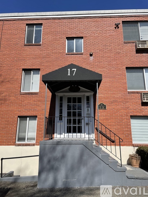 A red brick building with the number 17 on the front.