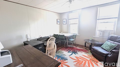 A living room with a brown table and a couch.