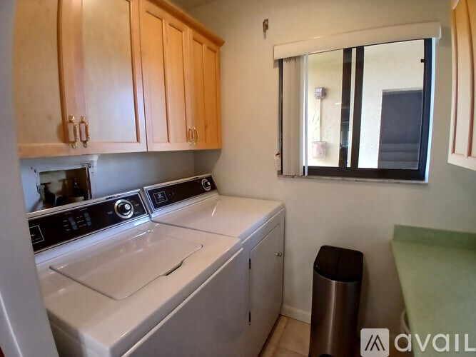 A kitchen with a washing machine and a dishwasher.
