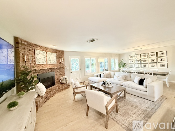 A living room with a fireplace and a couch.
