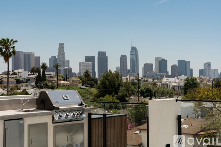 A cityscape with a clear sky and buildings of various heights.